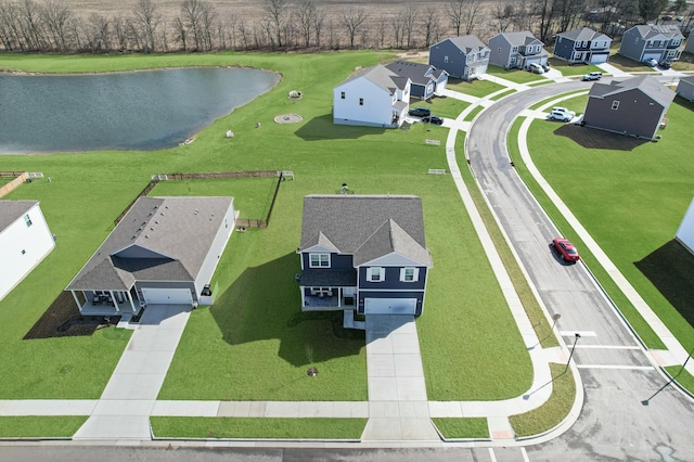 bird's eye view featuring a residential view and a water view