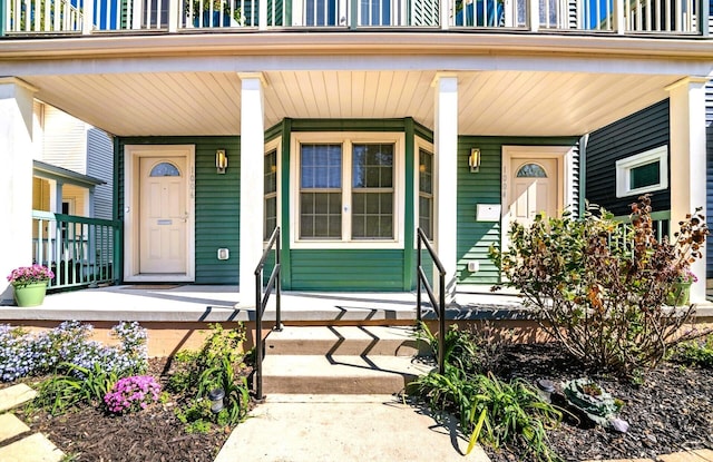 view of exterior entry with covered porch