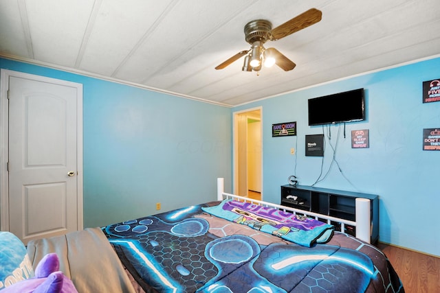 bedroom featuring hardwood / wood-style flooring and ceiling fan