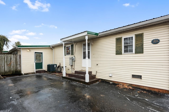 back of house with cooling unit and a patio area