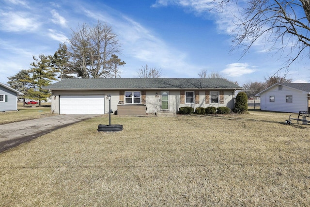 ranch-style home featuring driveway, a front lawn, and an attached garage