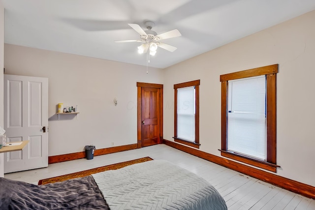 bedroom with light wood-type flooring and ceiling fan