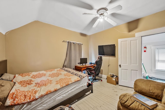 bedroom featuring ceiling fan, vaulted ceiling, and hardwood / wood-style floors