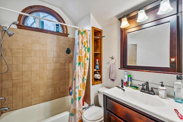 full bathroom featuring shower / tub combo with curtain, vanity, vaulted ceiling, and toilet