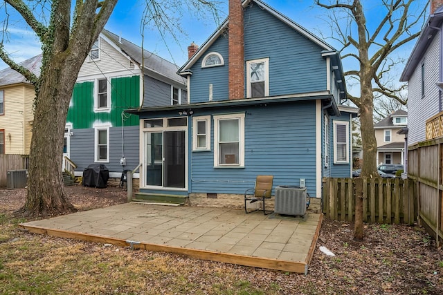 back of property featuring a patio and central air condition unit