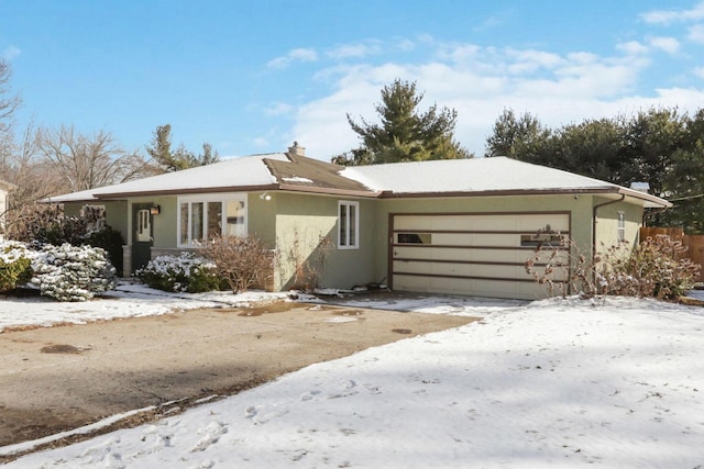 ranch-style home with a garage