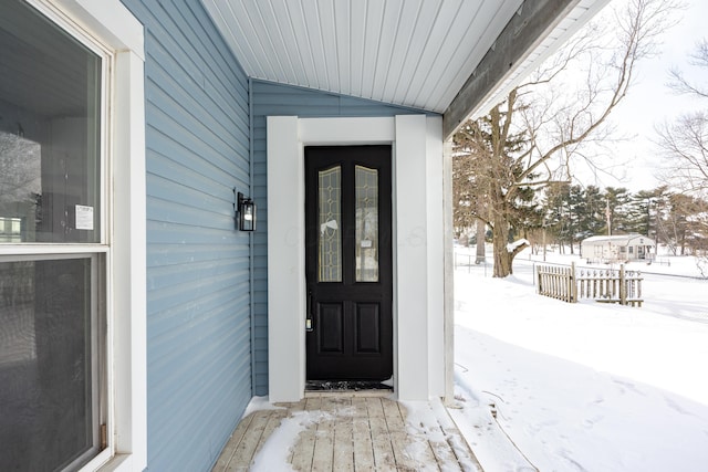 view of snow covered property entrance