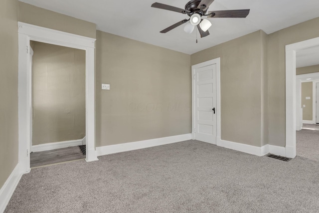 unfurnished bedroom with light carpet and ceiling fan