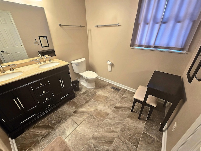 bathroom with vanity and toilet