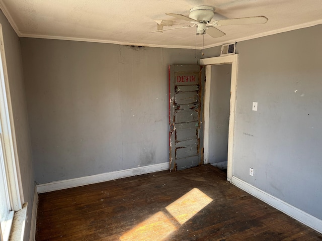 unfurnished room with ceiling fan, dark hardwood / wood-style flooring, and ornamental molding