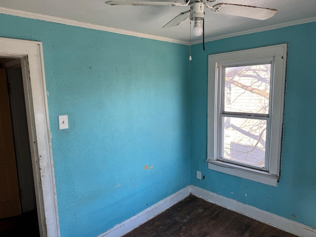 unfurnished room featuring ceiling fan, crown molding, and dark hardwood / wood-style floors