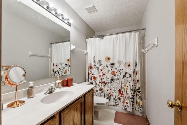 full bath with visible vents, toilet, vanity, and a textured ceiling