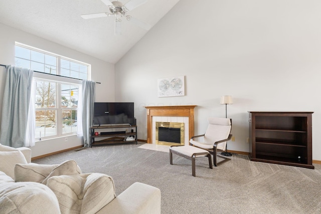 living area with light colored carpet, a fireplace, and baseboards