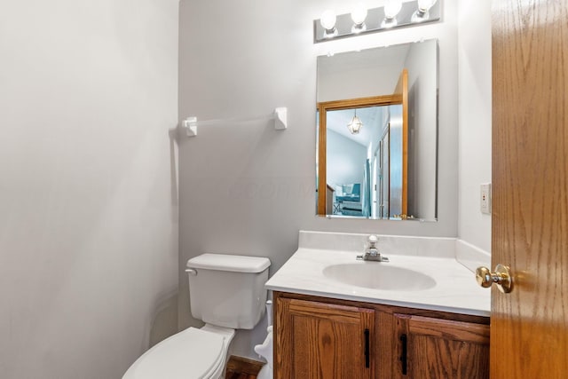 bathroom with toilet and vanity