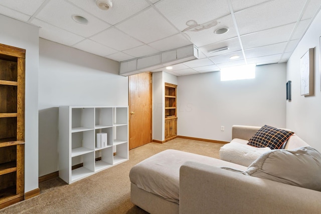 sitting room with light carpet, visible vents, a paneled ceiling, and baseboards