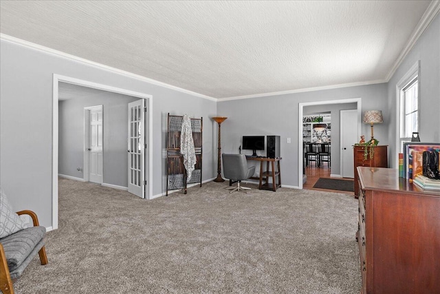 interior space with baseboards, carpet, ornamental molding, and a textured ceiling