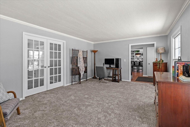 carpeted office space with a textured ceiling, french doors, baseboards, and ornamental molding