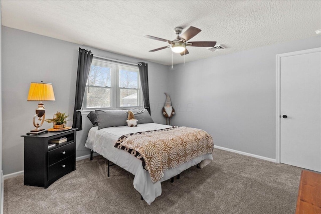 carpeted bedroom with a ceiling fan, baseboards, visible vents, and a textured ceiling