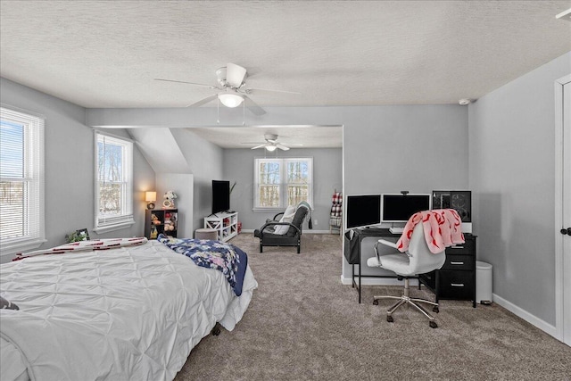 bedroom featuring ceiling fan, a textured ceiling, baseboards, and carpet