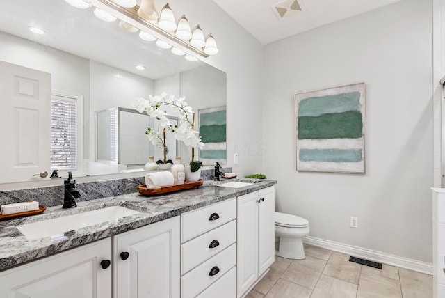 full bathroom featuring visible vents, a sink, and a shower stall