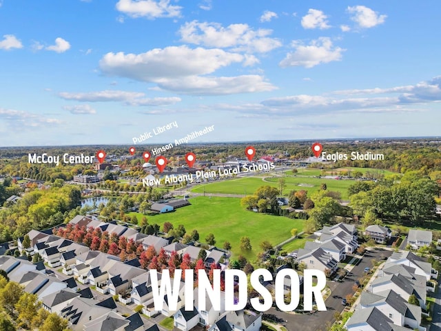 birds eye view of property with a residential view