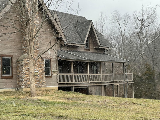 rear view of house with a yard