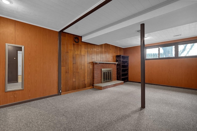 below grade area with wood walls, a fireplace, and baseboards