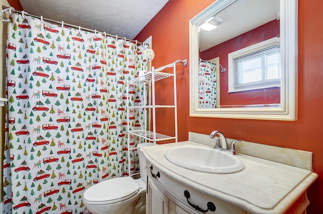 bathroom with toilet, a textured ceiling, vanity, and walk in shower