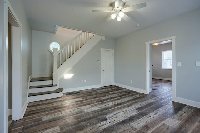 interior space with dark hardwood / wood-style flooring and ceiling fan