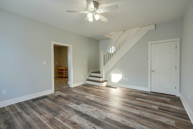 unfurnished room with ceiling fan and dark hardwood / wood-style floors