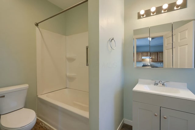 full bathroom featuring toilet,  shower combination, and vanity