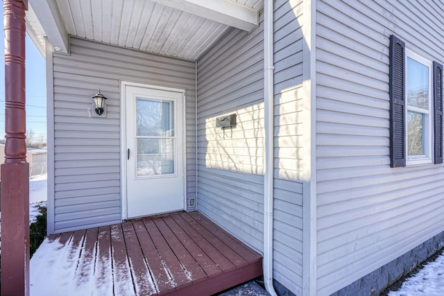 view of snow covered property entrance