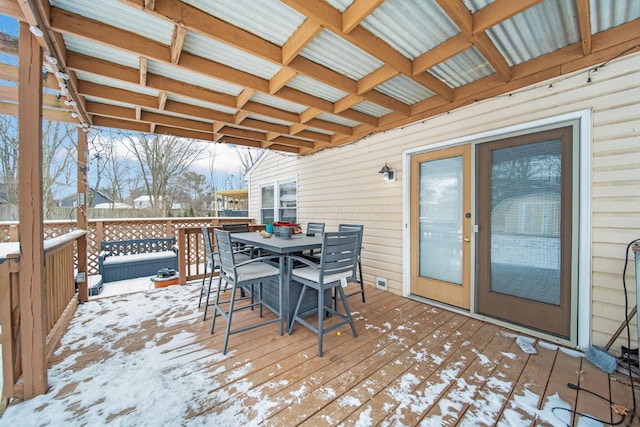 snow covered deck with outdoor dining area