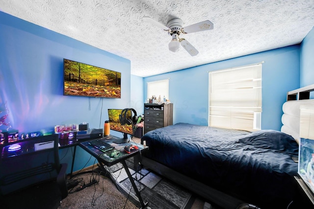 bedroom featuring a textured ceiling and ceiling fan