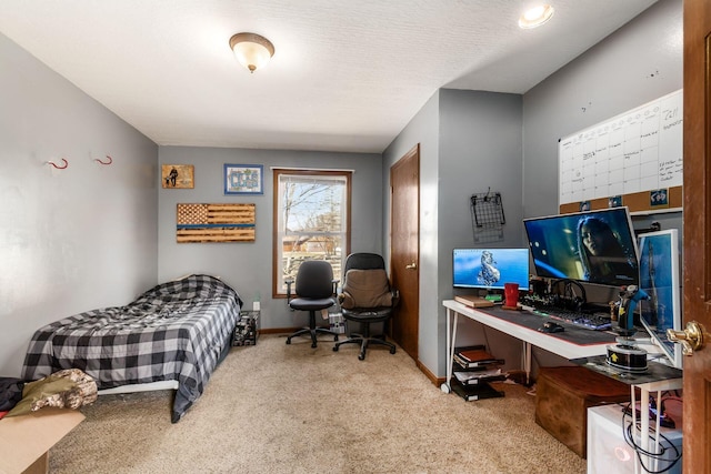 bedroom with baseboards and carpet flooring