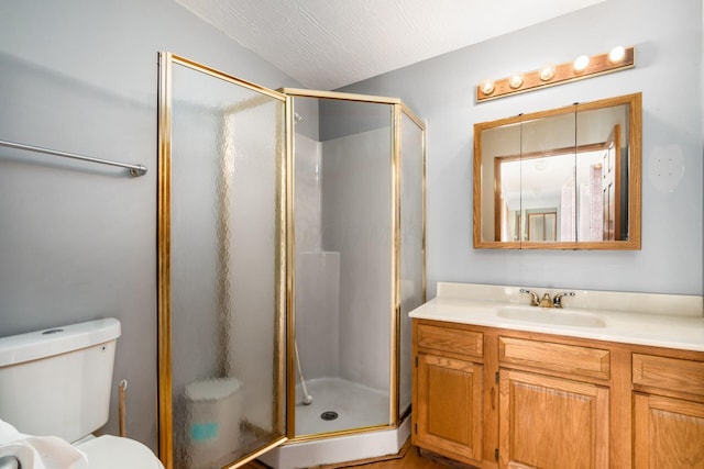 full bathroom featuring toilet, a stall shower, lofted ceiling, and vanity