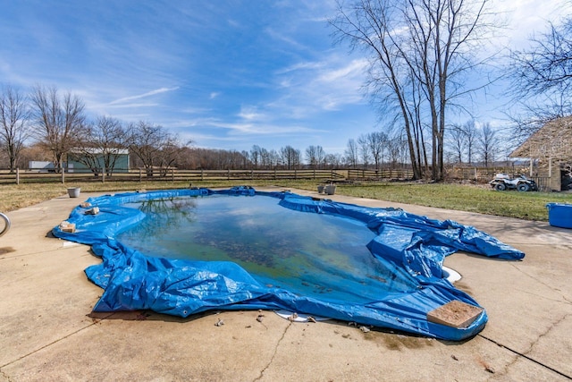 view of pool with a patio area, a fenced backyard, and a yard