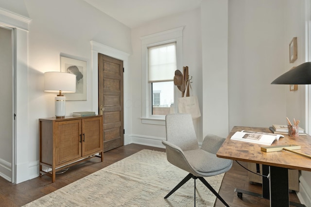 office space featuring dark wood-type flooring and baseboards