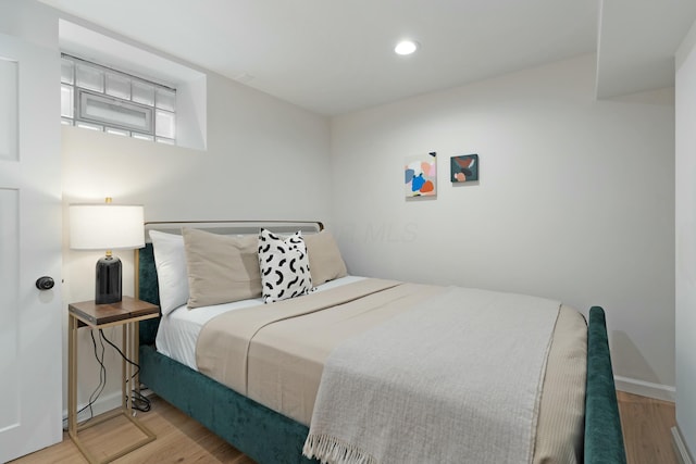 bedroom featuring recessed lighting, baseboards, and wood finished floors