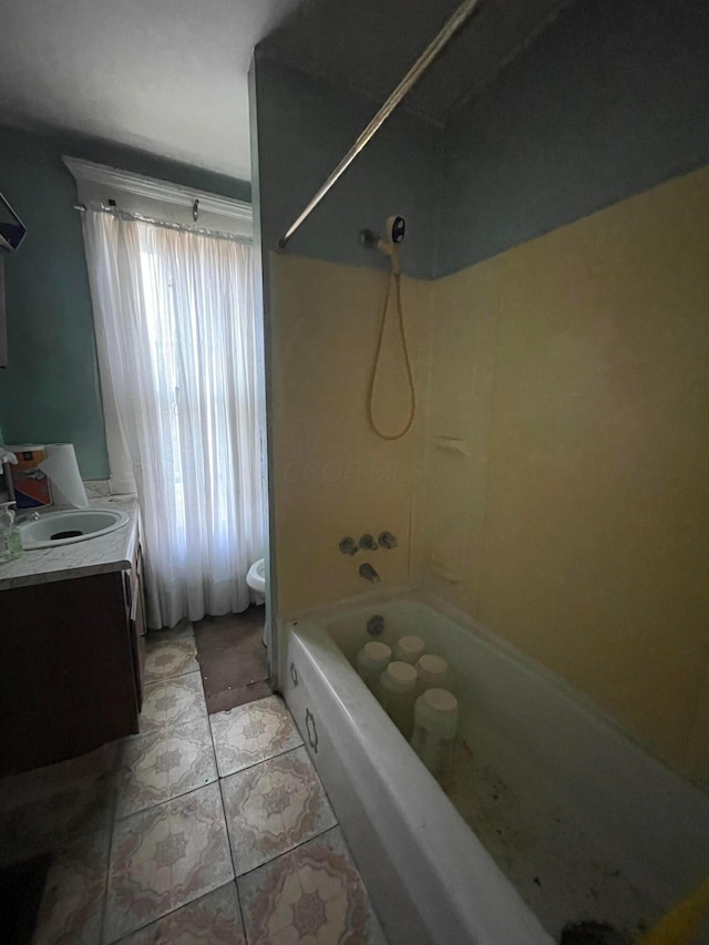 bathroom featuring vanity, tile patterned flooring, and shower / bathtub combination