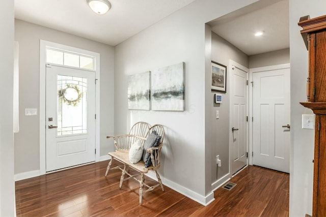 entrance foyer with dark hardwood / wood-style floors