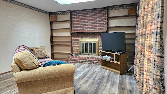 living room featuring hardwood / wood-style flooring and a fireplace