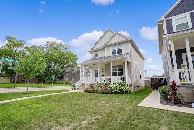 view of front of house featuring a front lawn and covered porch