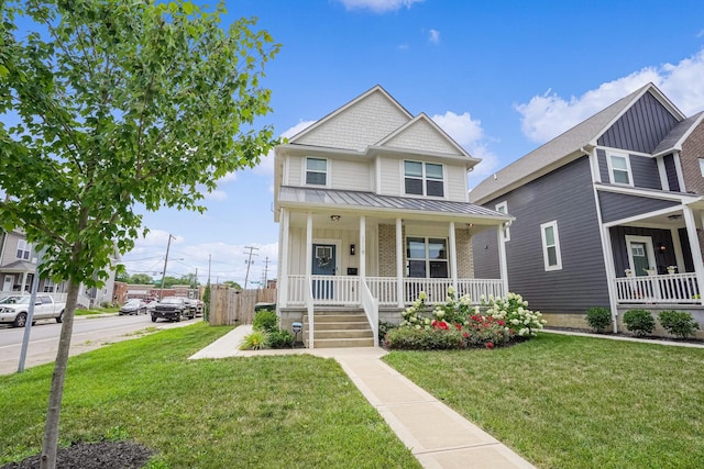 view of front of property featuring covered porch and a front yard