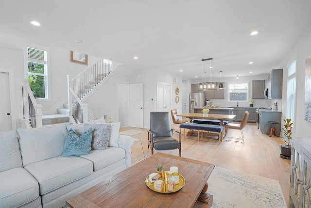 living room with light hardwood / wood-style flooring