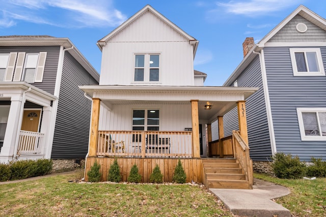 view of front of home featuring covered porch and a front lawn