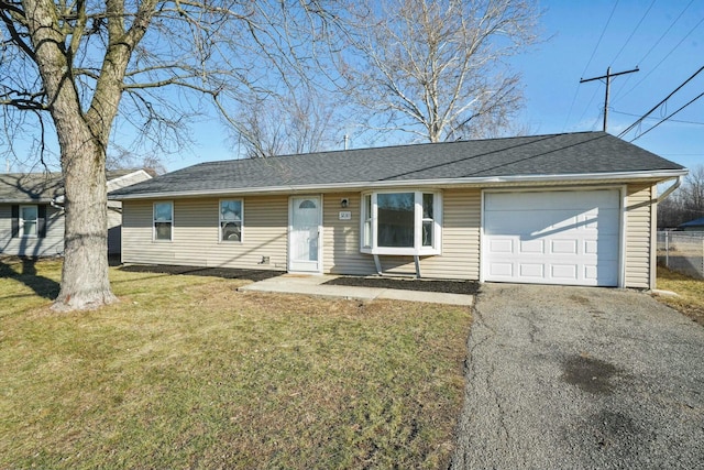 ranch-style home featuring a front yard and a garage