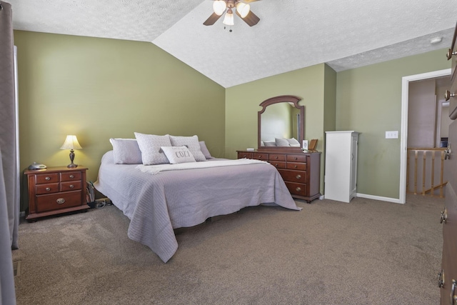 carpeted bedroom with a ceiling fan, vaulted ceiling, a textured ceiling, and baseboards