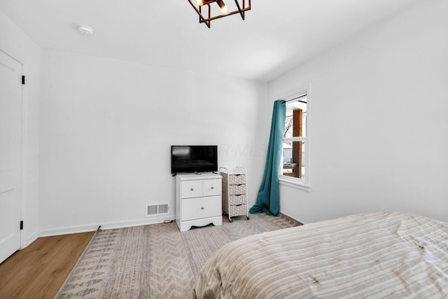 bedroom featuring light wood-type flooring