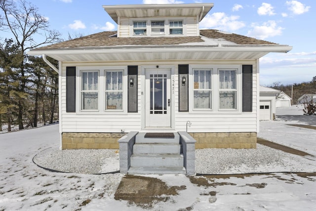 bungalow-style home with a garage